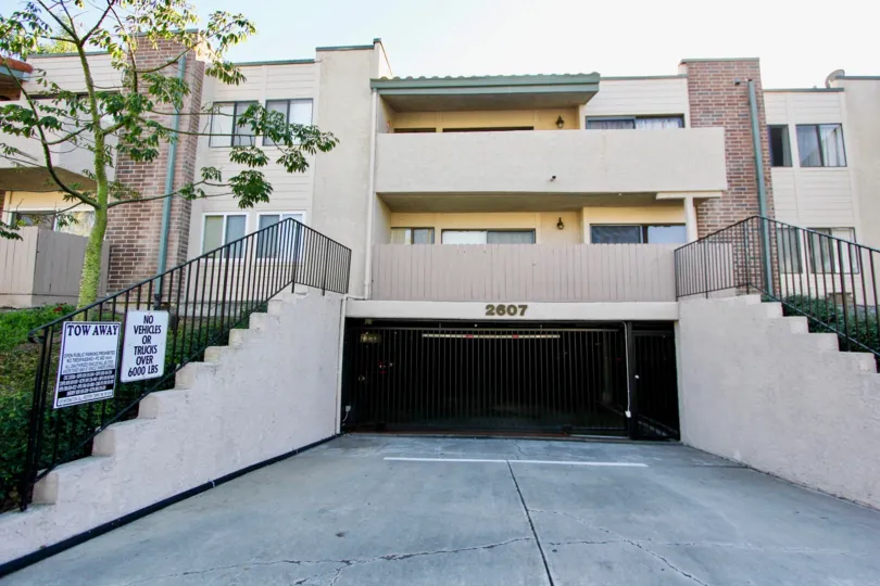 THE 2607 BUILDING IN THE SABRINA GREENS WITH THE UPSTAIRS, PLANTS, TREES