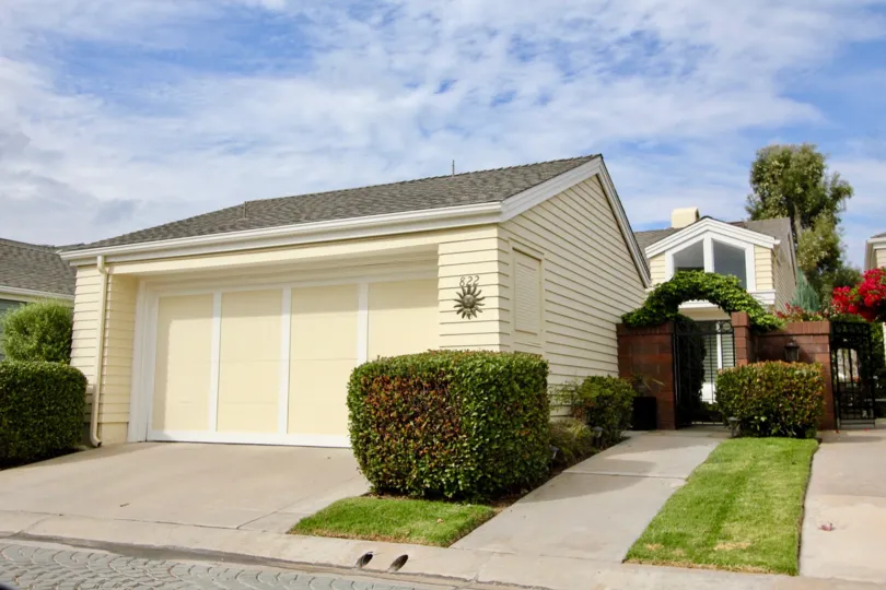 Small tree, gate and garage side view of Sea Cliff, Carlsbad, CA