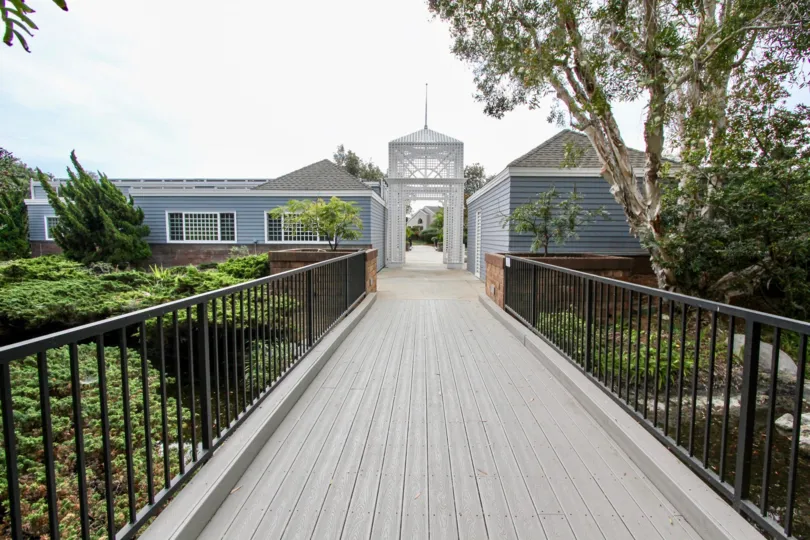 THE HOUSE IN THE SEA CLIFF WITH THE TREES, PLANTS, PATHWAY WITH STEEL GATE