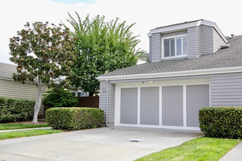 A newspaper sits in the driveway of a Sea Cliff community home in Carlsbad, CA
