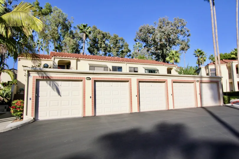 Five car garage sits on paved ground inside Sea Point Tennis Club in Carlsbad CA