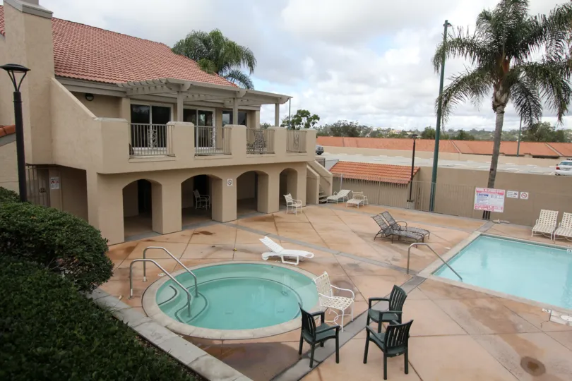 Inside the Villa in The Grove has Two Swimming Pools with chairs