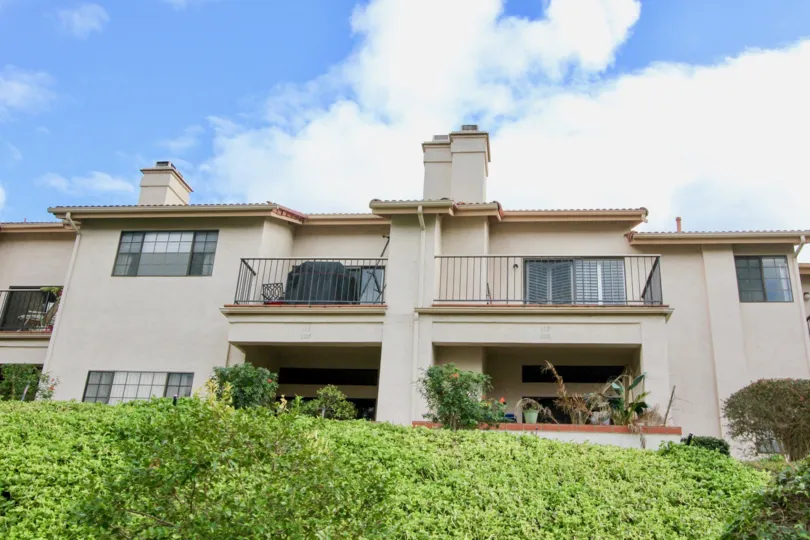 The sun is shining on multiple balconies in this unit located in The Villas.