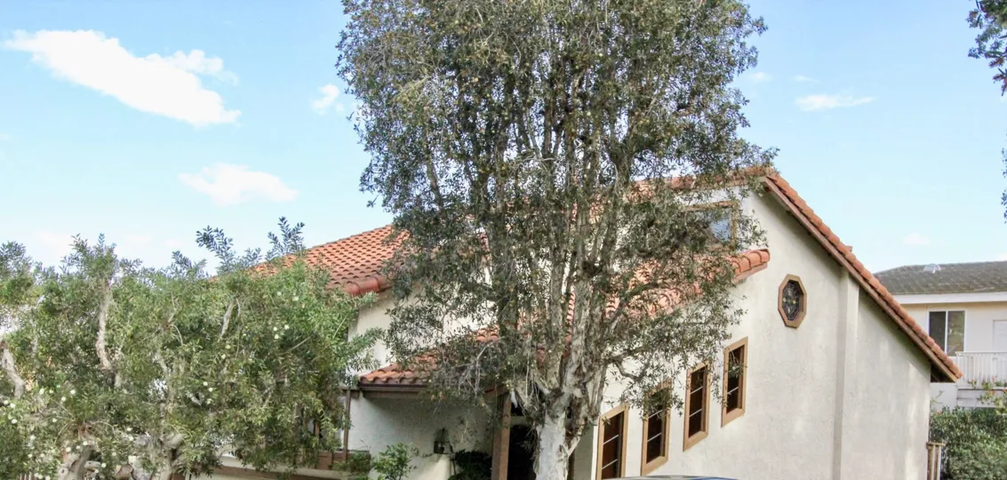 A giant green stands in front of the Villa La Costa located in Carlsbad CA
