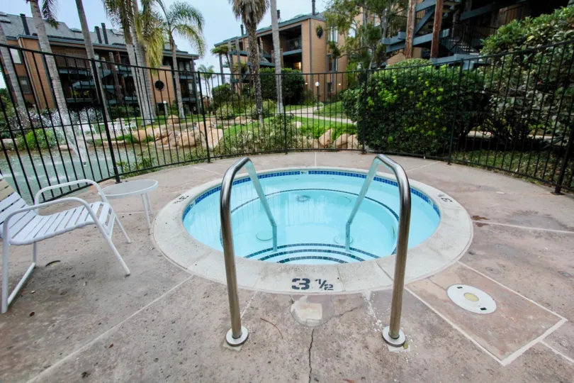 A hot tub is featured at Windsong Cove, with a bubbling water feature nearby.