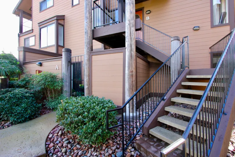 This midcentury modern Windsong Palms home is broken up into two units, with stairs leading to unit B.