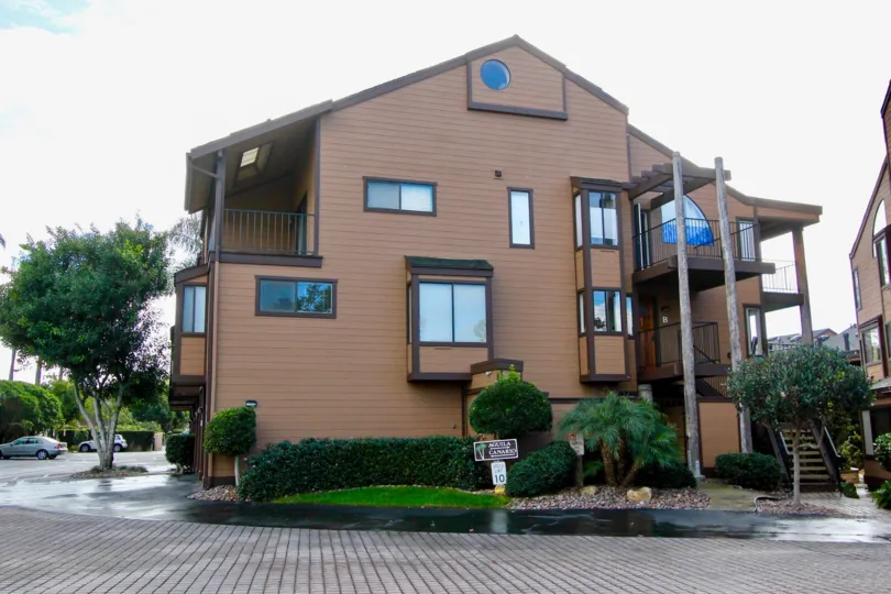 Road to the Apartment in Windsong Palms is fully wed and has board near the bush