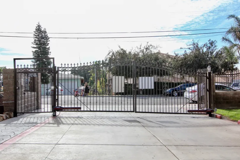 Entrance gate at ada terrace in chula vista californis, car and walkway