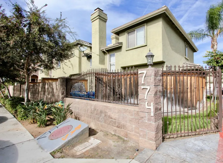 Gated property at 774 in Ada Terrace with chimney and satellite television.