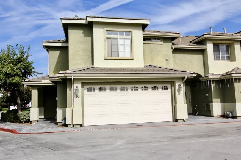 A front view of the garage of one of the two-story townhomes found in Ada Terrace neighborhood