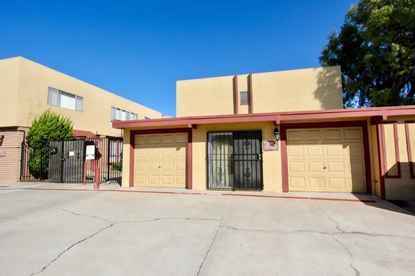 Garage doors of homes in the Amber community in Chula Vista, California on a clear day.