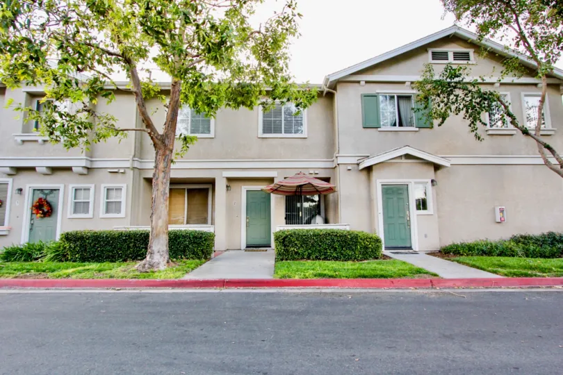 View of front doors at Antigua community on a cloudy day in Chula Vista, Ca.