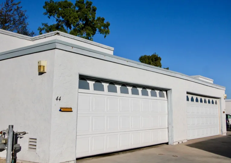 A garage door sits a few inches open at Autumn Hills condos