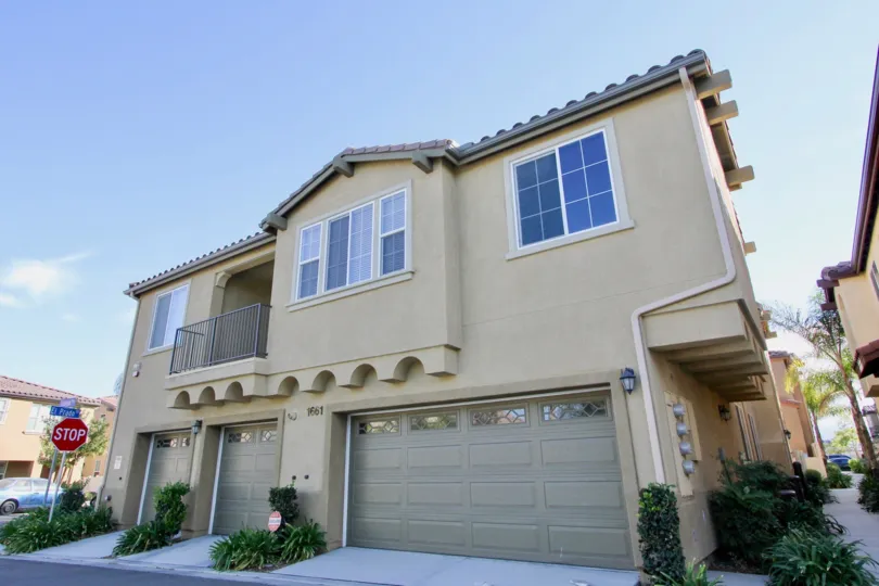 A Three-garage house underlooks a sunny day in Avalon park, CA.