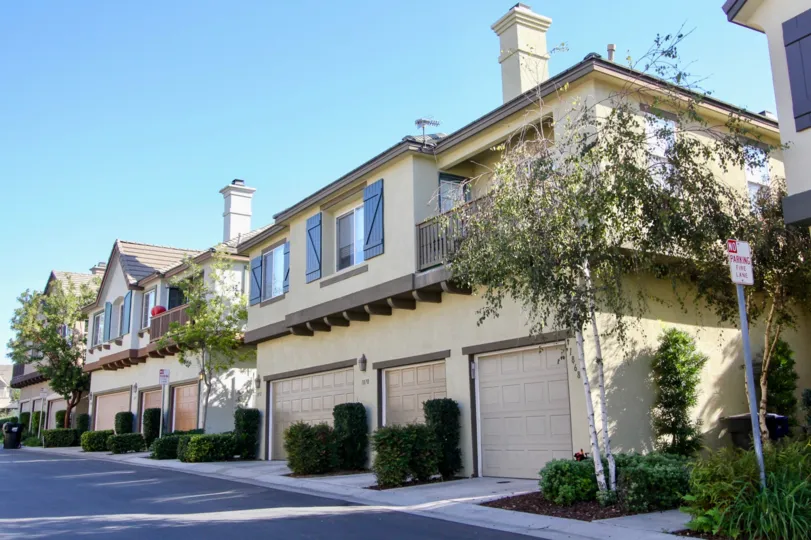 Three garages at the base of a condominiums inside the Belleme Chateaux community at Chula Vista CA