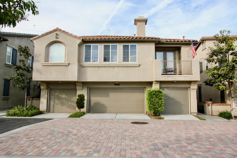 This beautiful modernly designed home is located in the Belleza community in Chula VIsta California, it has a brick driveway and a cozy balcony.