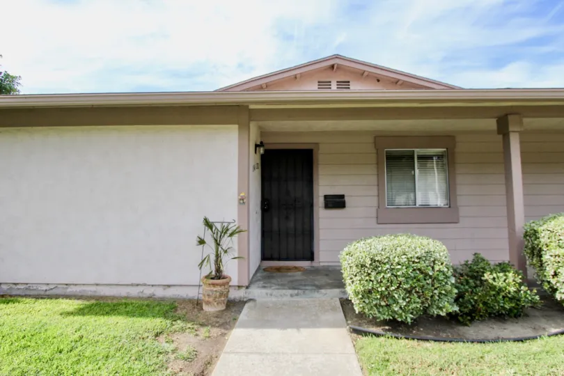 Front door and sidewalk leading to a home in Bon Vivant in Chula Vista, Ca.