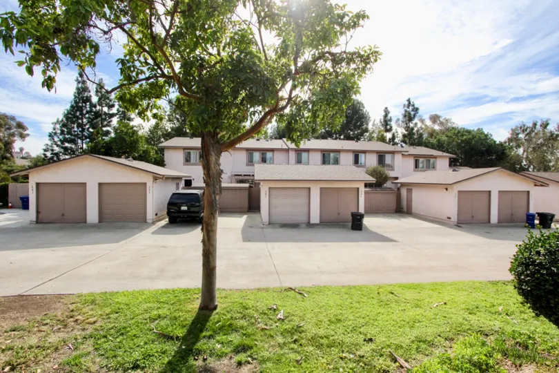 Detached double car garages (1 car garage per unit) with large backlane and green space in Bon Vivant