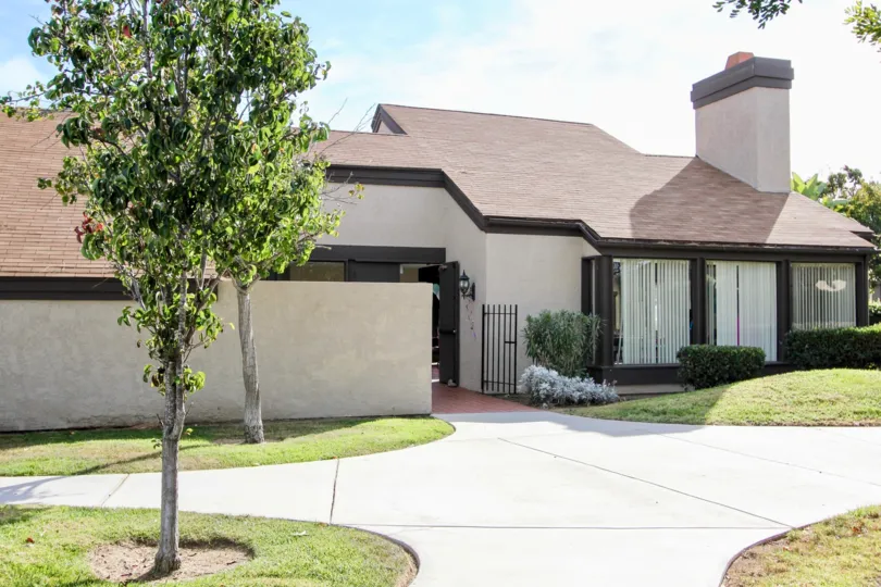 Three large floor length mirror sit on the front of a home at Bonita Terrace