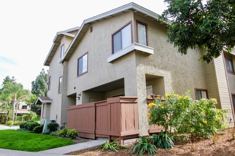In the Brandywine Classics area of Chula Vista yellow flowers are in front of a house.