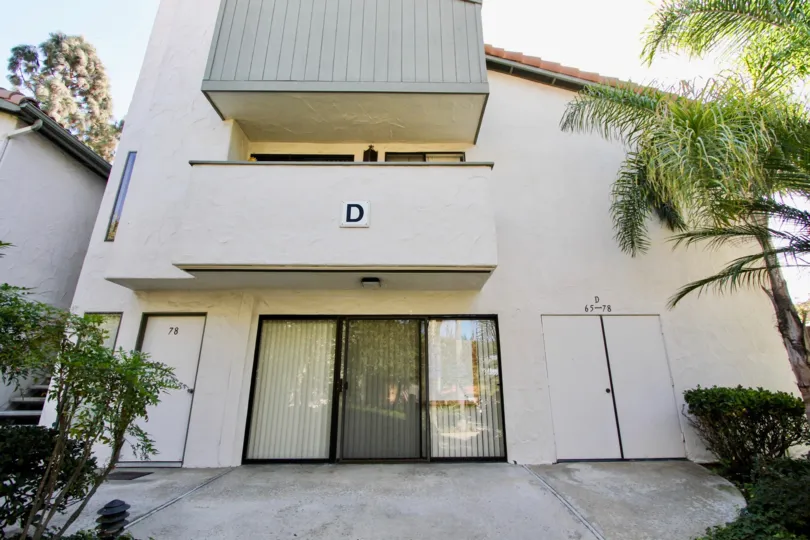 3 storey building with private balconies and textured stucco exteriors and spanish roofs at Brentwood Arms