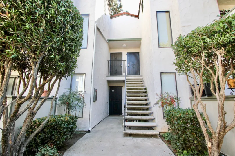 Stairwell to second-floor apartment at Brentwood Arms in Chula Vista, CA