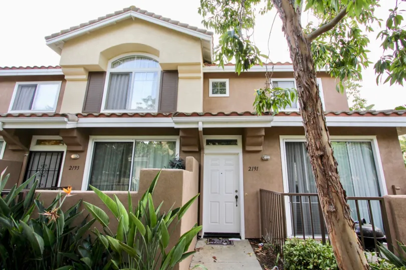 The exterior view of Cabo Bahia in Chula Vista shows the front door and garden walkway