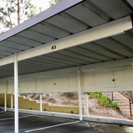 Covered carport with locking overhead storage area at Camelot community in Chula Vista, California