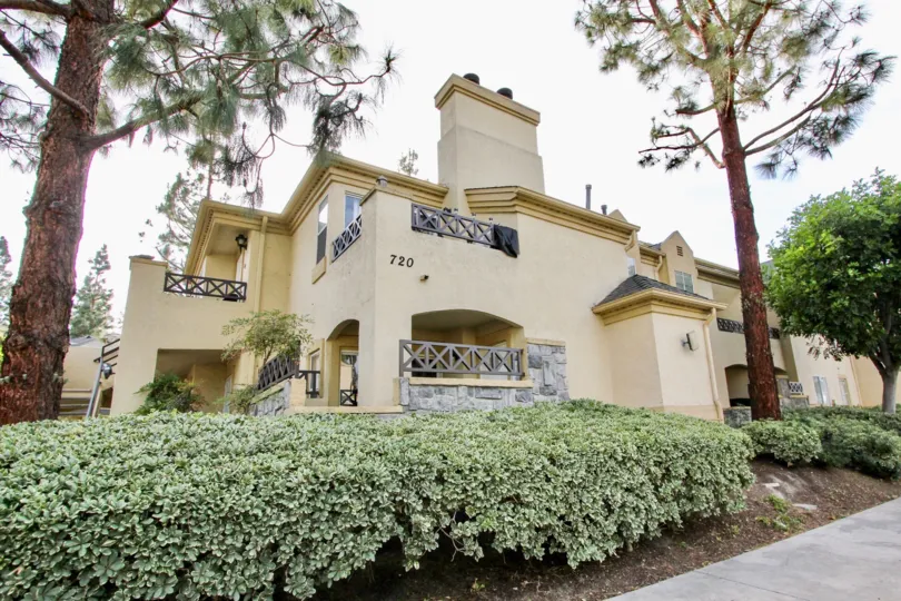 The lovely landscaping and home exterior of the Camelot Community Homes in Chula Vista, CA