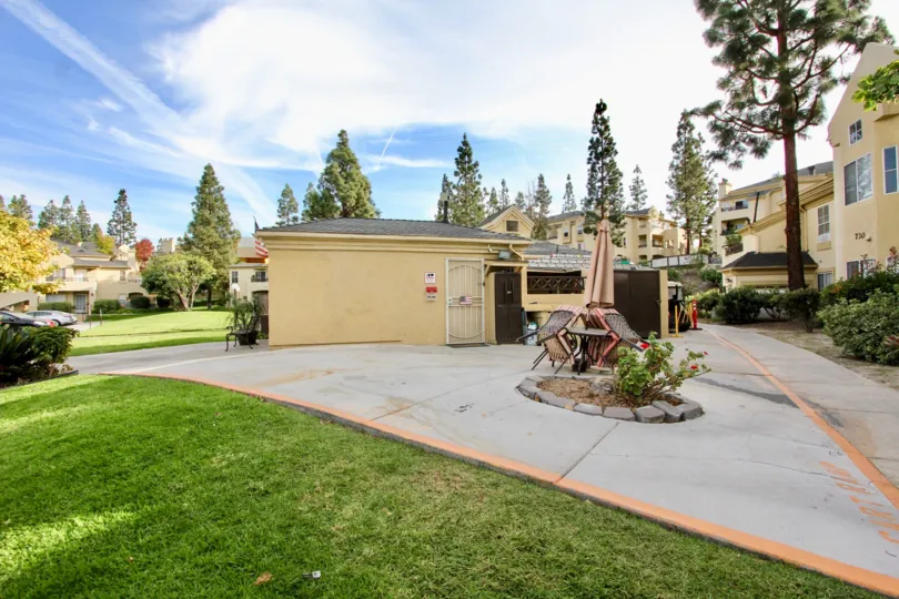Beautiful sunny day with Green lawn in front of house showing spacious garden in Camelot area of Chula vista
