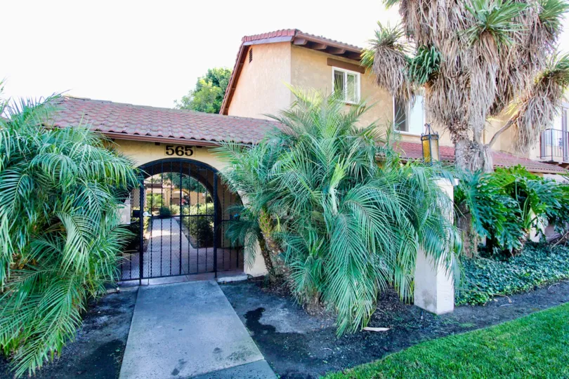 Secure gated entry with landscaping features in Chula Vista