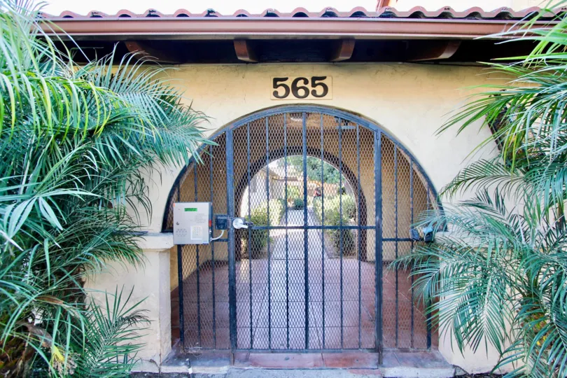 A gate to an alley of a residence 565 in Casa de Moss