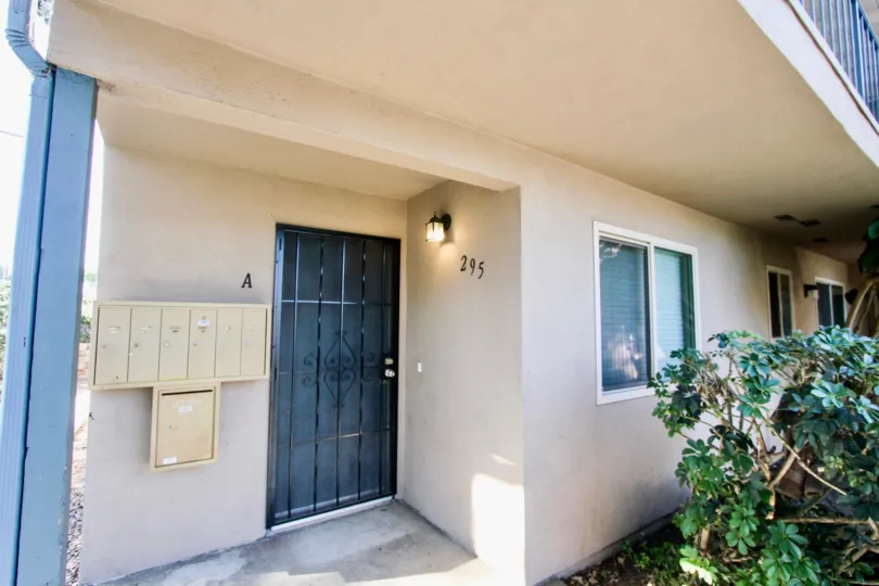 The outside of a Casa Verse Home in Chula Vista by the front door and above a balcony