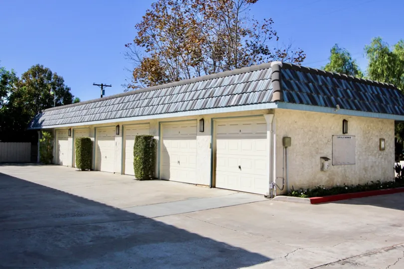 A closed public garage in the Centre Villas community with traditional roofing.