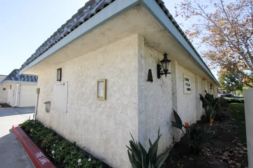 Single story home with a light on the side of it in Centre villas at Chula Vista CA