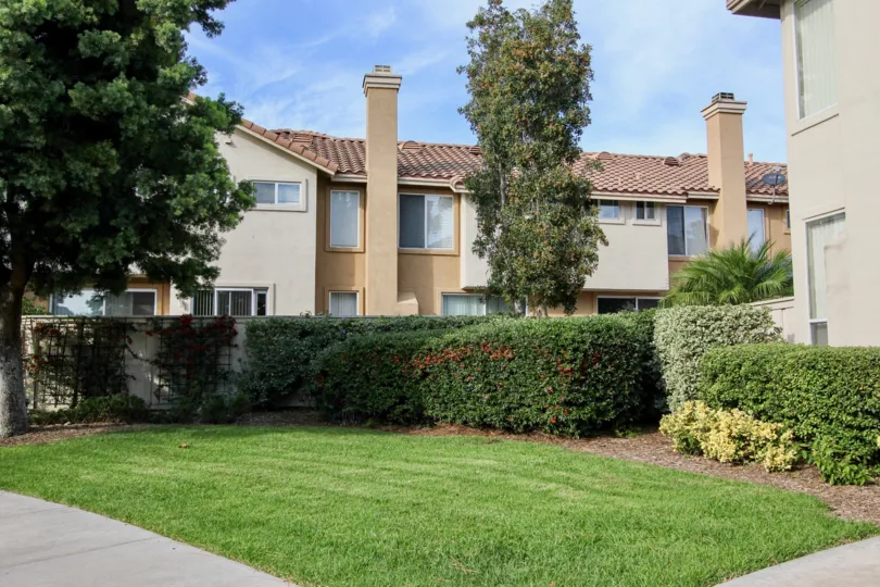 Front garden view with trees in Chapala Community, Chula Vista, CA