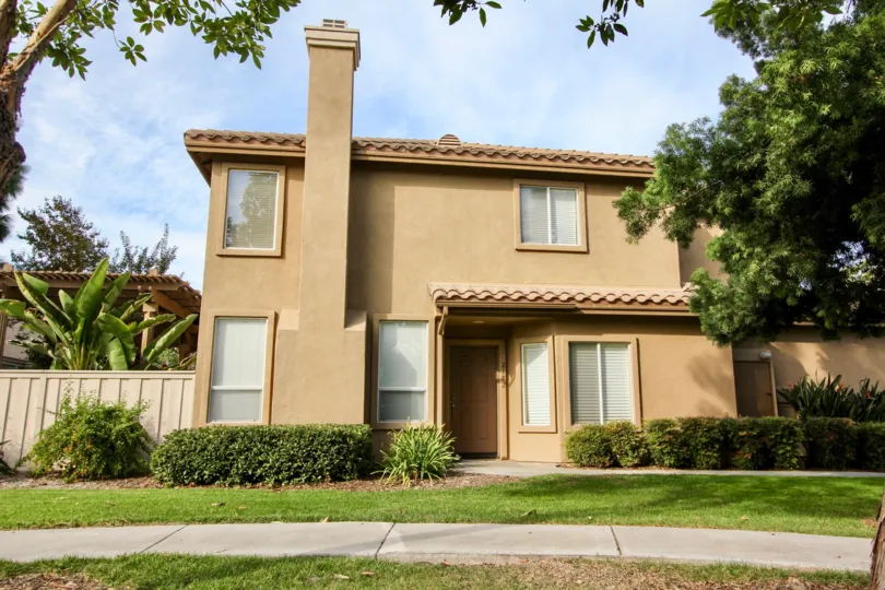 A two-story, beige home in the Chapala community in Chula Vista, CA