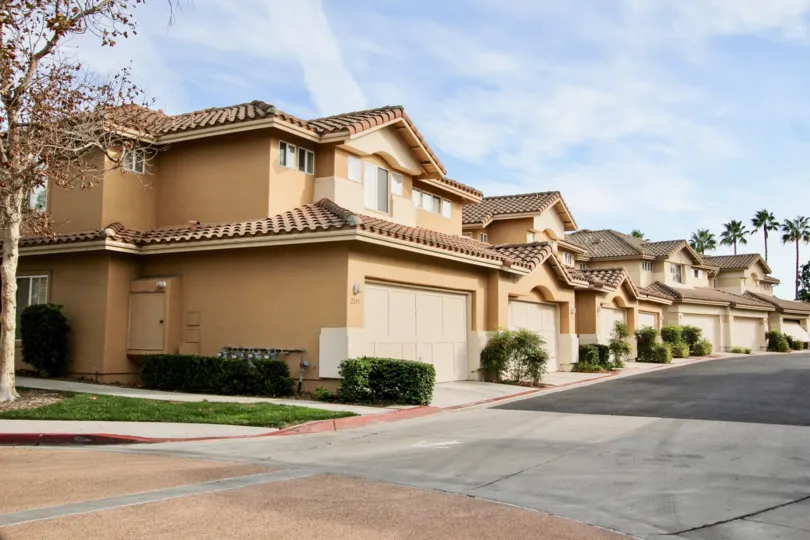Contemporary modelled attached homes with double car garages and Spanish style roofs in Chapala