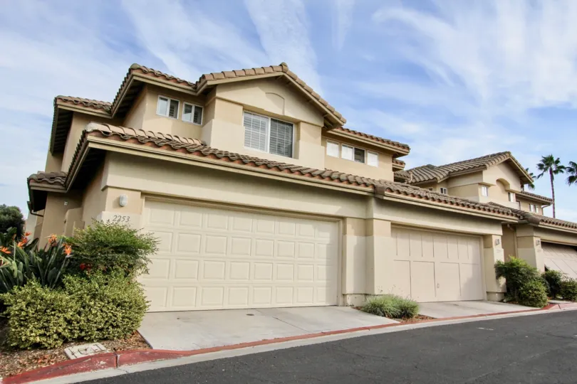 Contemporary style home with spanish influence with double car garage and landscaping in Chapala