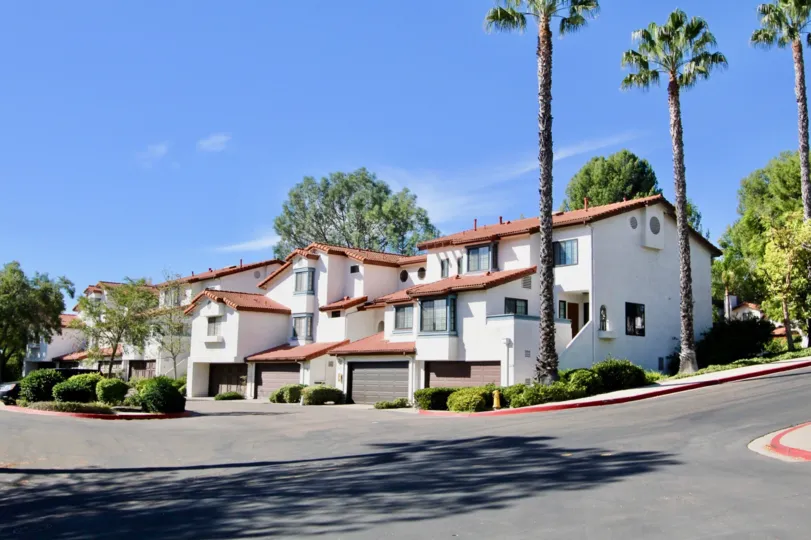 THE APARTMENT IN THE CHARTER POINT WITH THE ROAD SIDE, PLANTS, TREES, SHUTTERS
