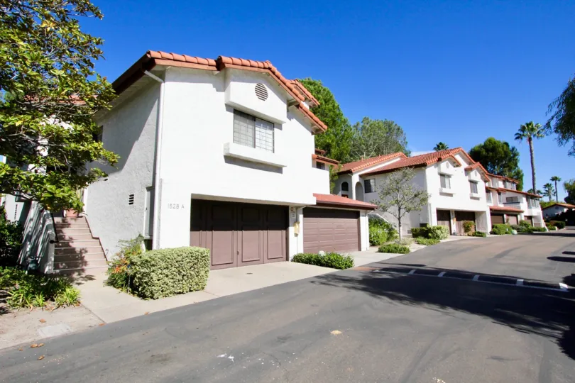 A picture of the Charter Point neighborhood in Chula Vista. Two houses are depicted, both with two garages.