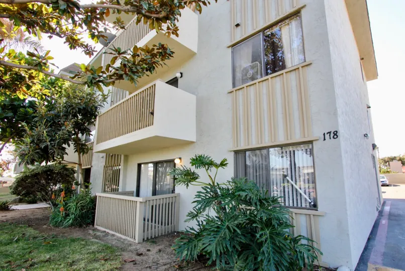 THE 178 APARTMENT IN THE CHULA VISTA TERRACE WITH THE BALCONI, PLANTS, GRASS, TREES, WINDOWS, ROAD, LAMPS