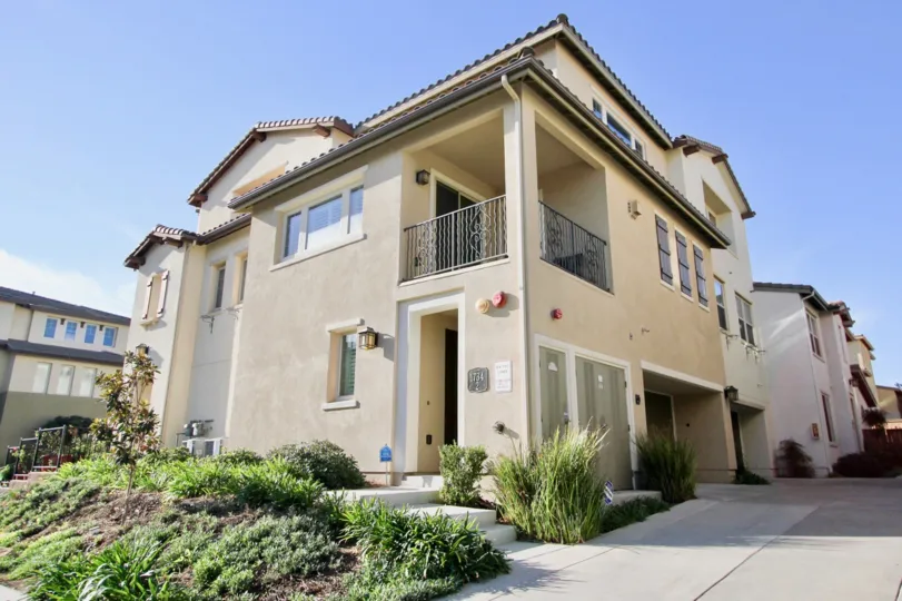 Inviting exterior view of the Clover community on a sunny day in Chula Vista, CA