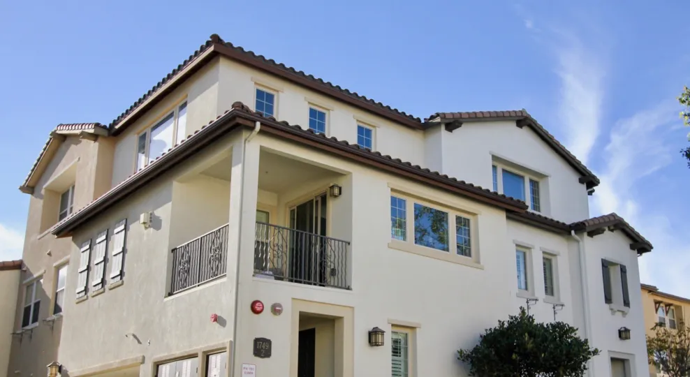 An upward view of a large home of the Clover community in Chula Vista, California on a clear day.
