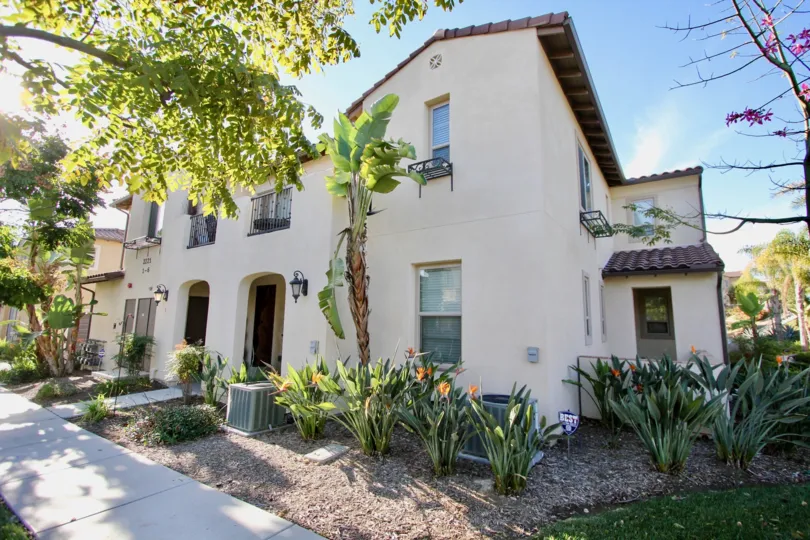 A multistory home in Cordova, surrounded by desert flowers and trees