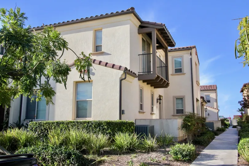 A two story white & brown residential building in Chula Vista CA at Cordova