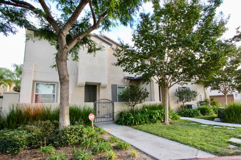 This rustic modern building sits in behind big beautiful trees in Chula Vista California