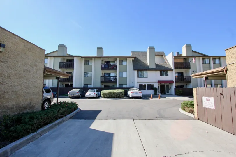 A sunny view of the Del Neva Community and parking lot in Chula Vista, CA