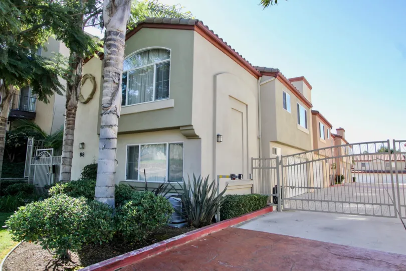 A beautiful two story condo with a balcony view with a attached car garage