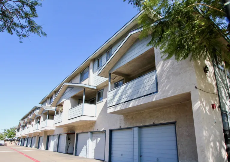 Peaked roofs sit on top of balconies on a building at Gentry Villas